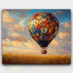 Skyborne Kaleidoscope paint by numbers kit of a stained glass style hot air balloon over golden fields