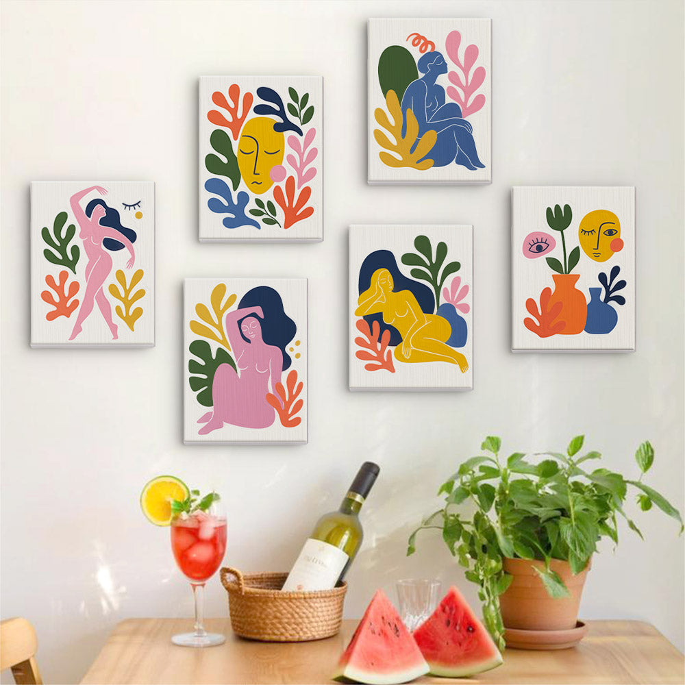 Six finished Abstract Figures mini paintings hung on a wall above a table