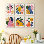 Abstract Figures mini paintings displayed as a gallery wall in a sunny kitchen