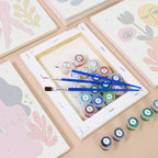 Numbered paint pots and brushes on a pre-stretched Abstract Figures mini canvas