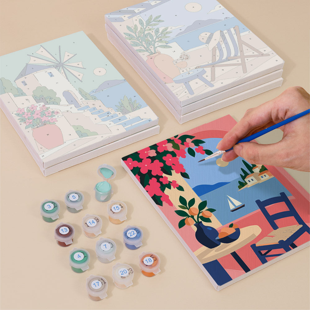 Painting one of the Aegean Daydream designs next to a stack of mini canvases
