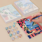 Painting one of the Aegean Daydream designs next to a stack of mini canvases