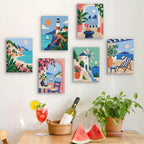 Six finished Aegean Daydream mini paintings hung on a wall above a table