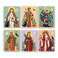 All Saints Night Icons mini paint by numbers set: six folk-art saint portraits with golden halos, lanterns, black cats, crows and jack-o'-lanterns