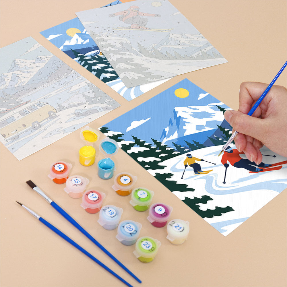 Filling in an Alpine Ski Days mini canvas with numbered acrylic paints and a fine brush
