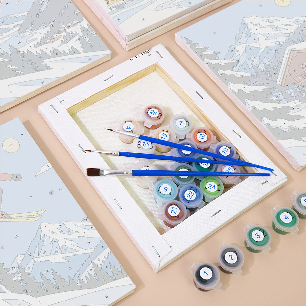 Numbered paint pots and brushes on a pre-stretched Alpine Ski Days mini canvas