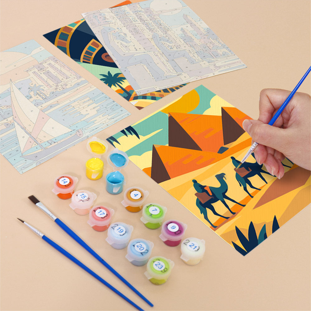 Filling in an Ancient Egypt mini canvas with numbered acrylic paints and a fine brush