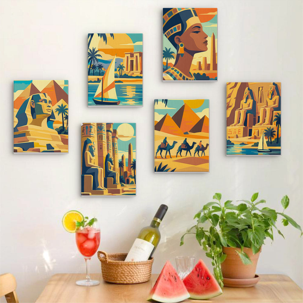 Six finished Ancient Egypt mini paintings hung on a wall above a table