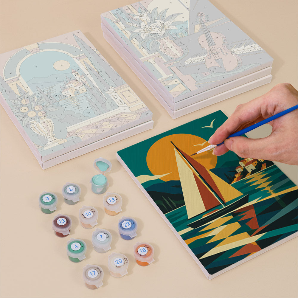 Painting one of the Art Deco Elegance designs next to a stack of mini canvases