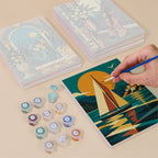 Painting one of the Art Deco Elegance designs next to a stack of mini canvases