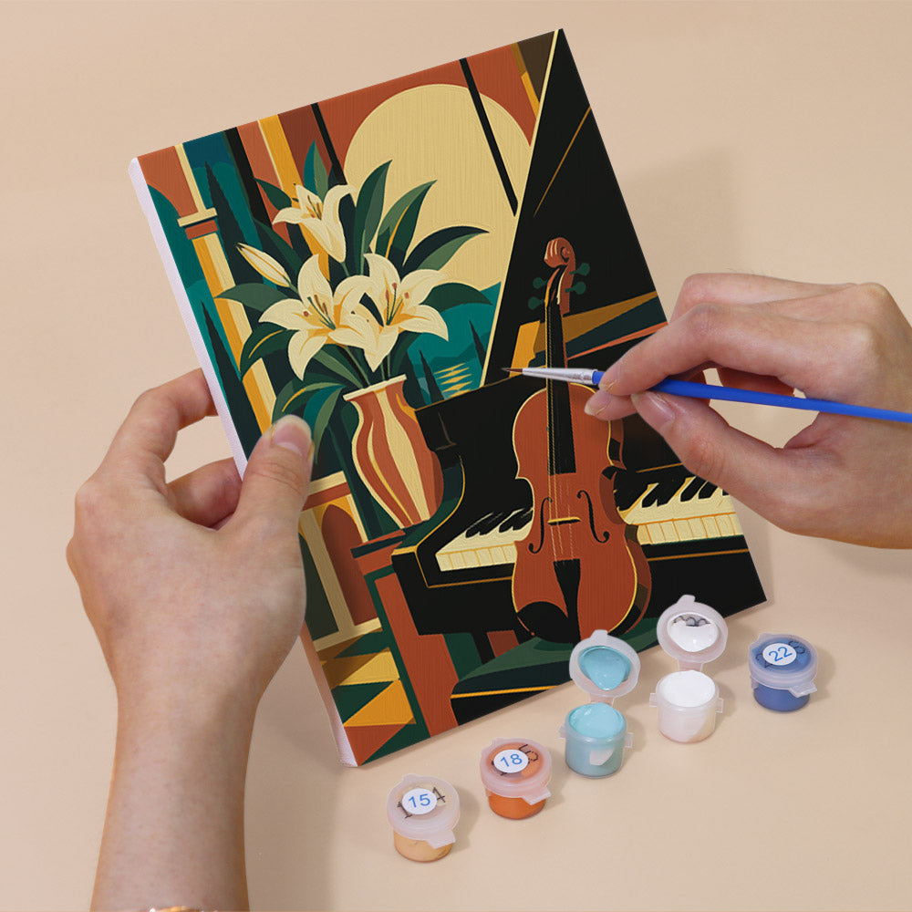 Hand holding an Art Deco Elegance mini canvas while painting the details