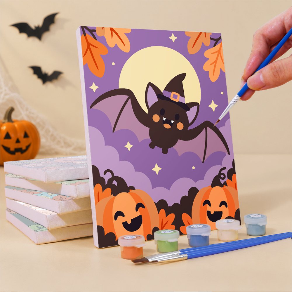 Painting an Autumn Critter Costumes mini canvas propped up beside numbered acrylic paints