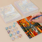 Painting one of the Autumn Rain Promenade designs next to a stack of mini canvases