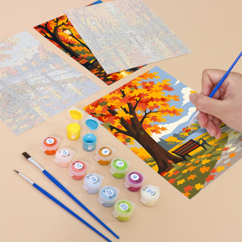 Filling in an Autumn Rain Promenade mini canvas with numbered acrylic paints and a fine brush