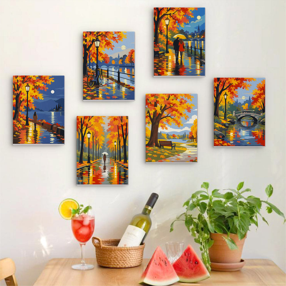 Six finished Autumn Rain Promenade mini paintings hung on a wall above a table