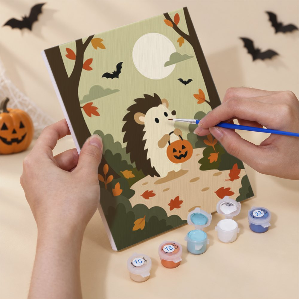 What's included without a frame: six rolled Autumn Woodland Cottage mini canvases, acrylic paints, three brushes and layout