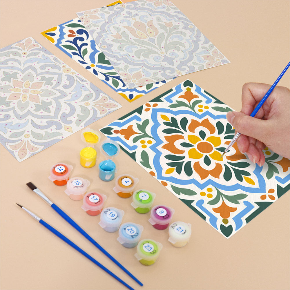 Filling in an Azulejo Tiles mini canvas with numbered acrylic paints and a fine brush
