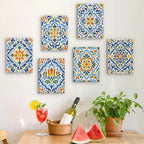 Six finished Azulejo Tiles mini paintings hung on a wall above a table