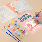 Filling in a Bathroom Bliss mini canvas with numbered acrylic paints and a fine brush