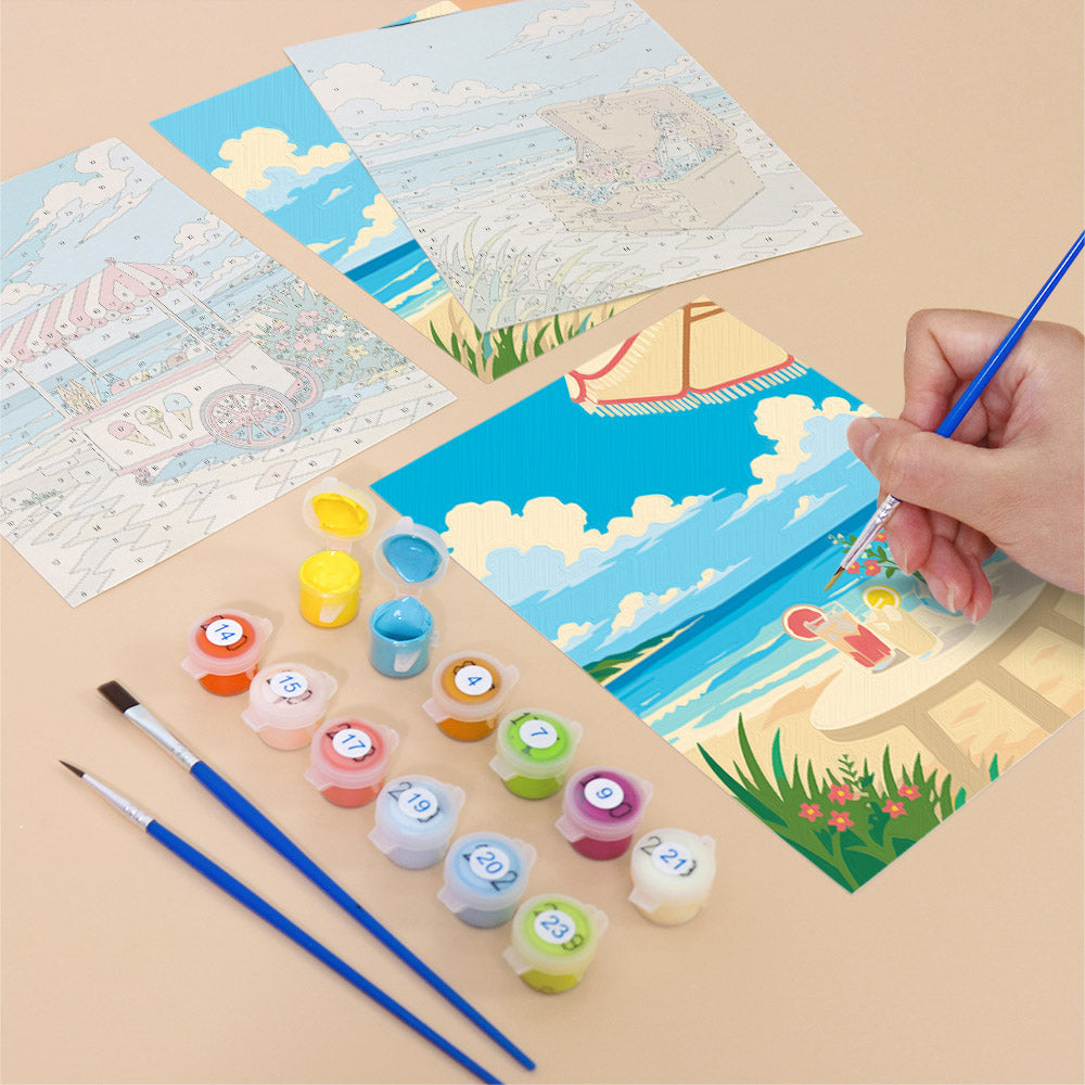 Filling in a Beach Day mini canvas with numbered acrylic paints and a fine brush