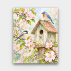 Birdhouse in Bloom paint by numbers kit of a weathered birdhouse with a bluebird and a chickadee among pink blossoms