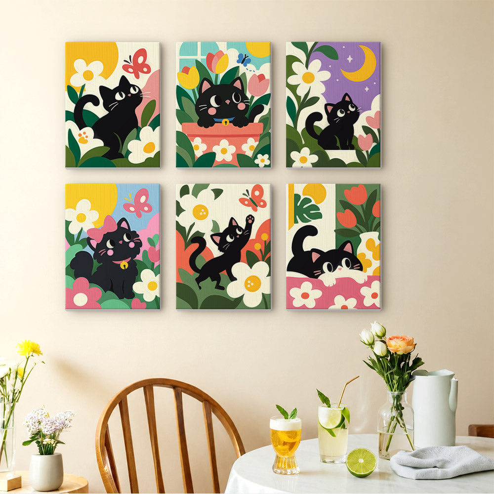 Black Cat Garden mini paintings displayed as a gallery wall in a sunny kitchen