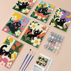 Black Cat Garden mini paint by numbers kit with six numbered canvases, acrylic paints, brushes and layout