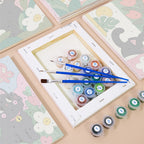 Numbered paint pots and brushes on a pre-stretched Black Cat Garden mini canvas