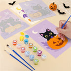 Filling in a Black Cat Treats mini canvas with numbered acrylic paints and a fine brush
