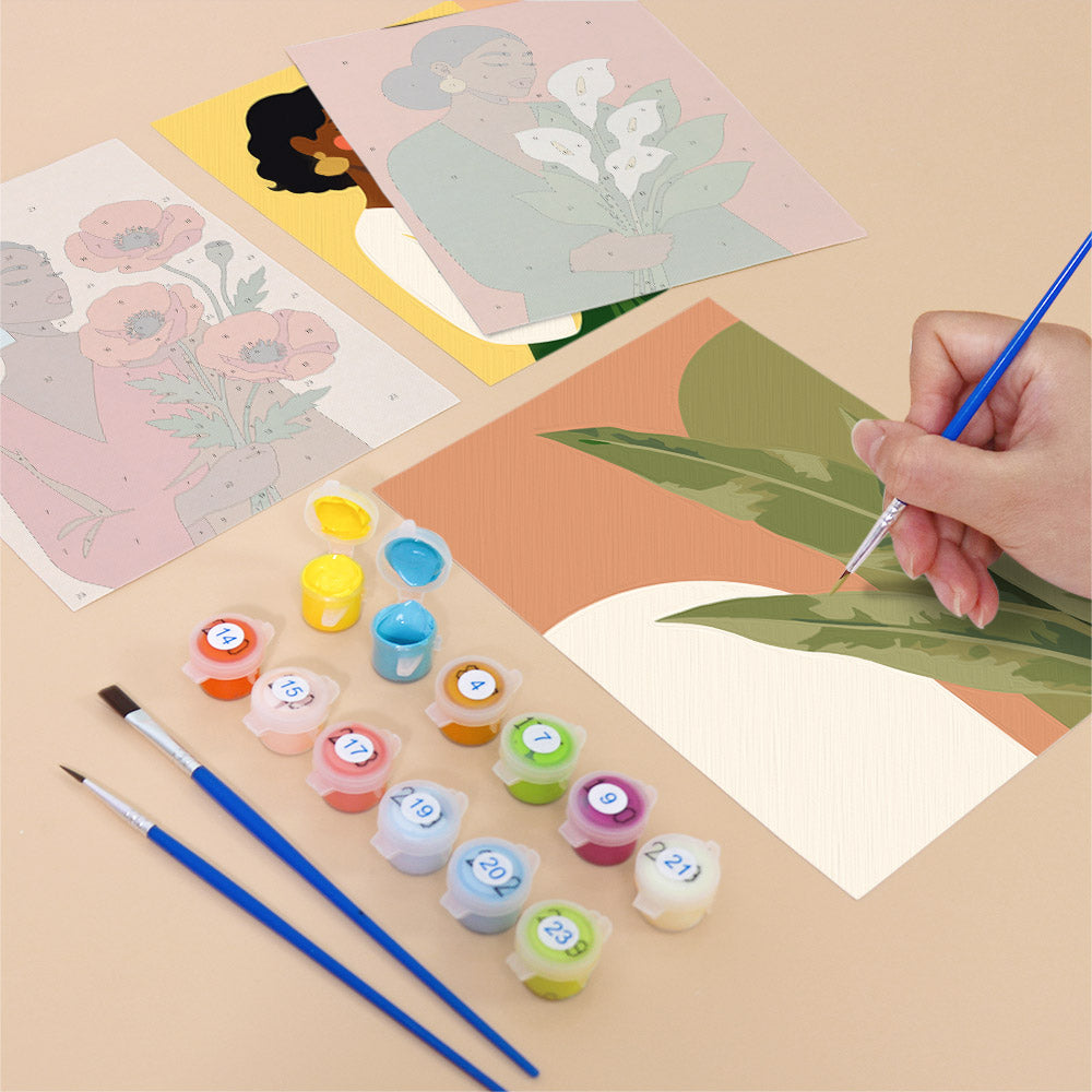 Filling in a Blooming Muses mini canvas with numbered acrylic paints and a fine brush