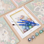 Numbered paint pots and brushes on a pre-stretched Blossom Critters mini canvas