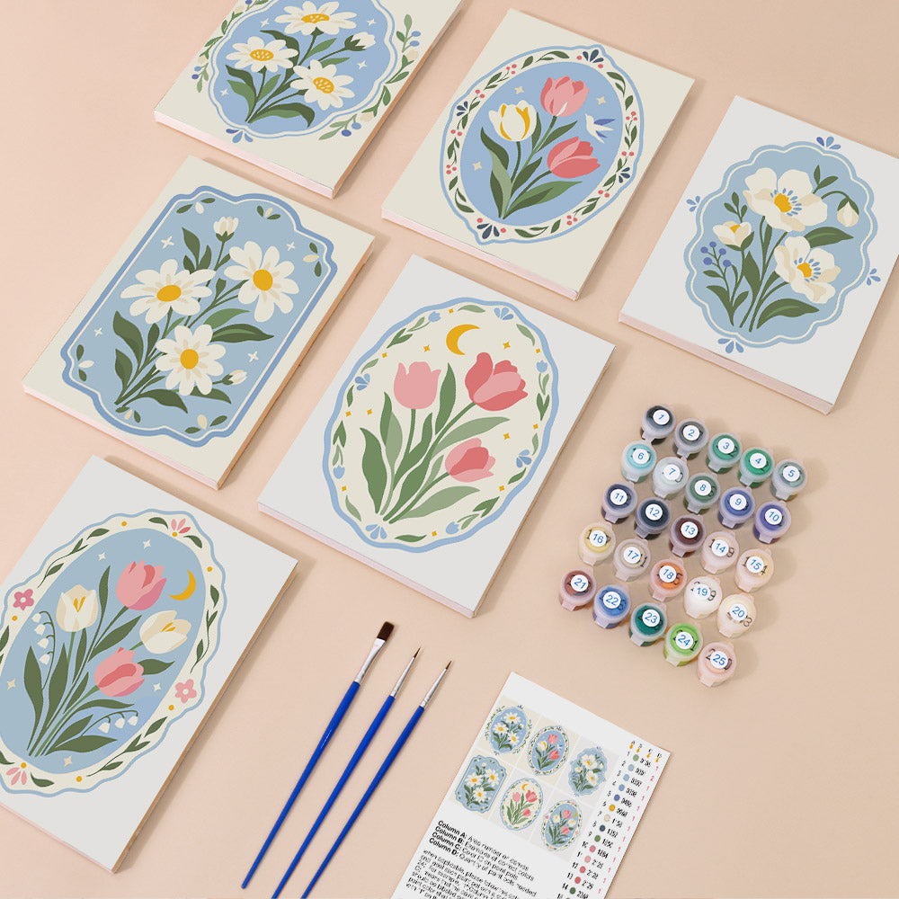Blue Folk Florals mini paint by numbers kit with six numbered canvases, acrylic paints, brushes and layout