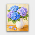 Blue Hydrangea Jug paint by numbers kit of blue and lavender hydrangeas in a white ceramic pitcher on a wooden table