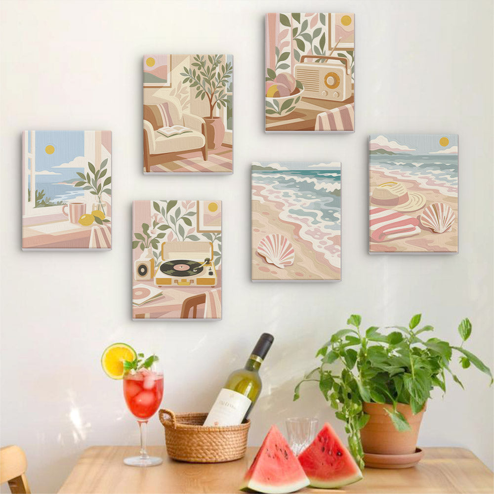 Six finished Blush Beach House mini paintings hung on a wall above a table