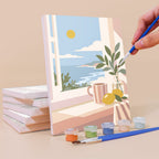 Painting a Blush Beach House mini canvas propped up beside numbered acrylic paints