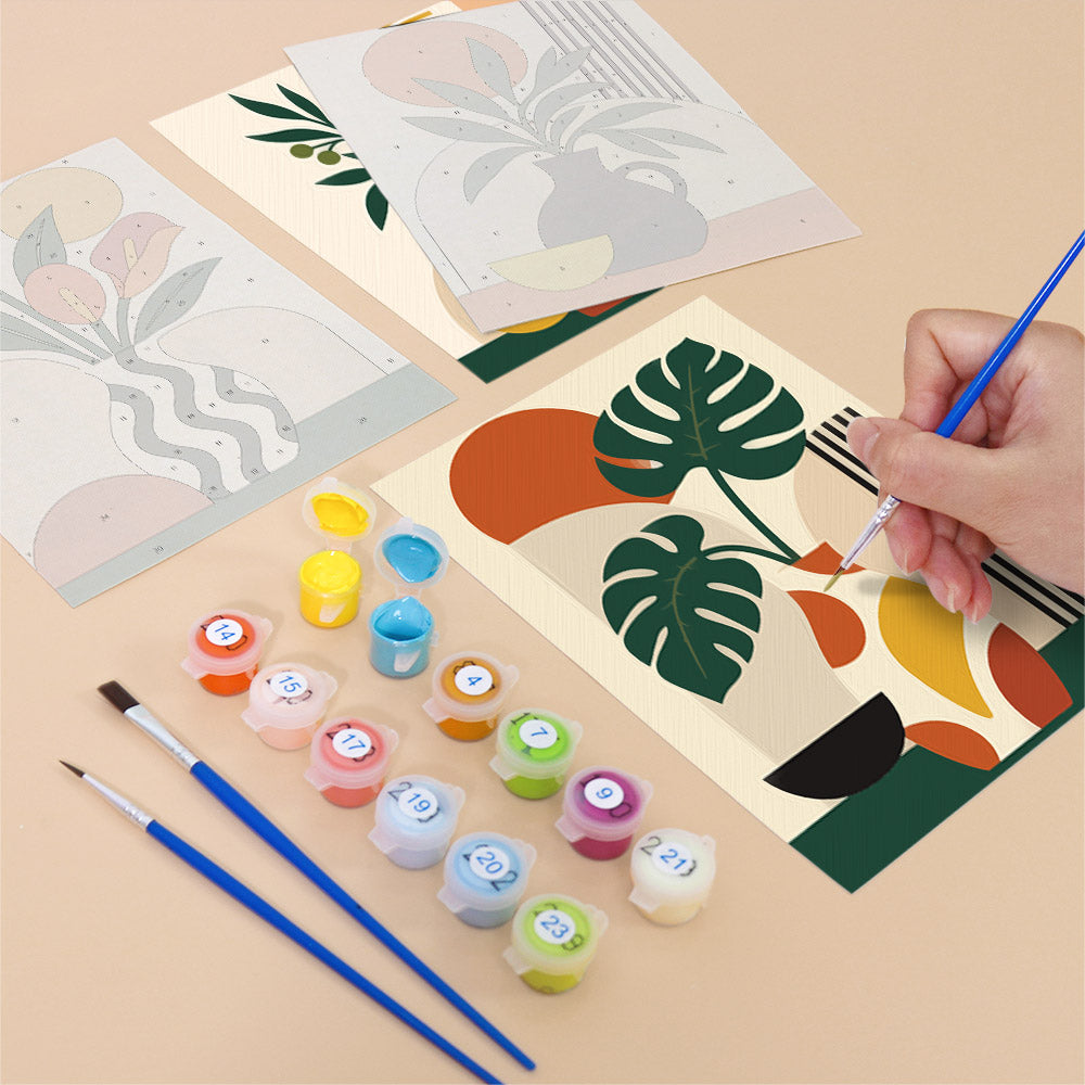 Filling in a Boho Botanica mini canvas with numbered acrylic paints and a fine brush