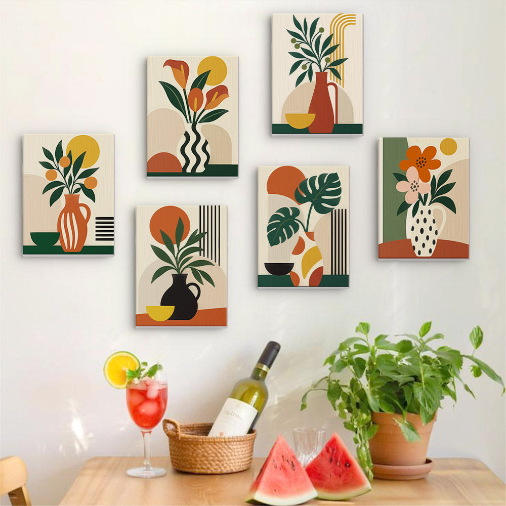 Six finished Boho Botanica mini paintings hung on a wall above a table
