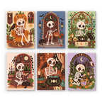 Boho Skeleton Hideaways mini paint by numbers set: six boho Halloween scenes of skeletons relaxing at home among plants, candles, pumpkins and cats