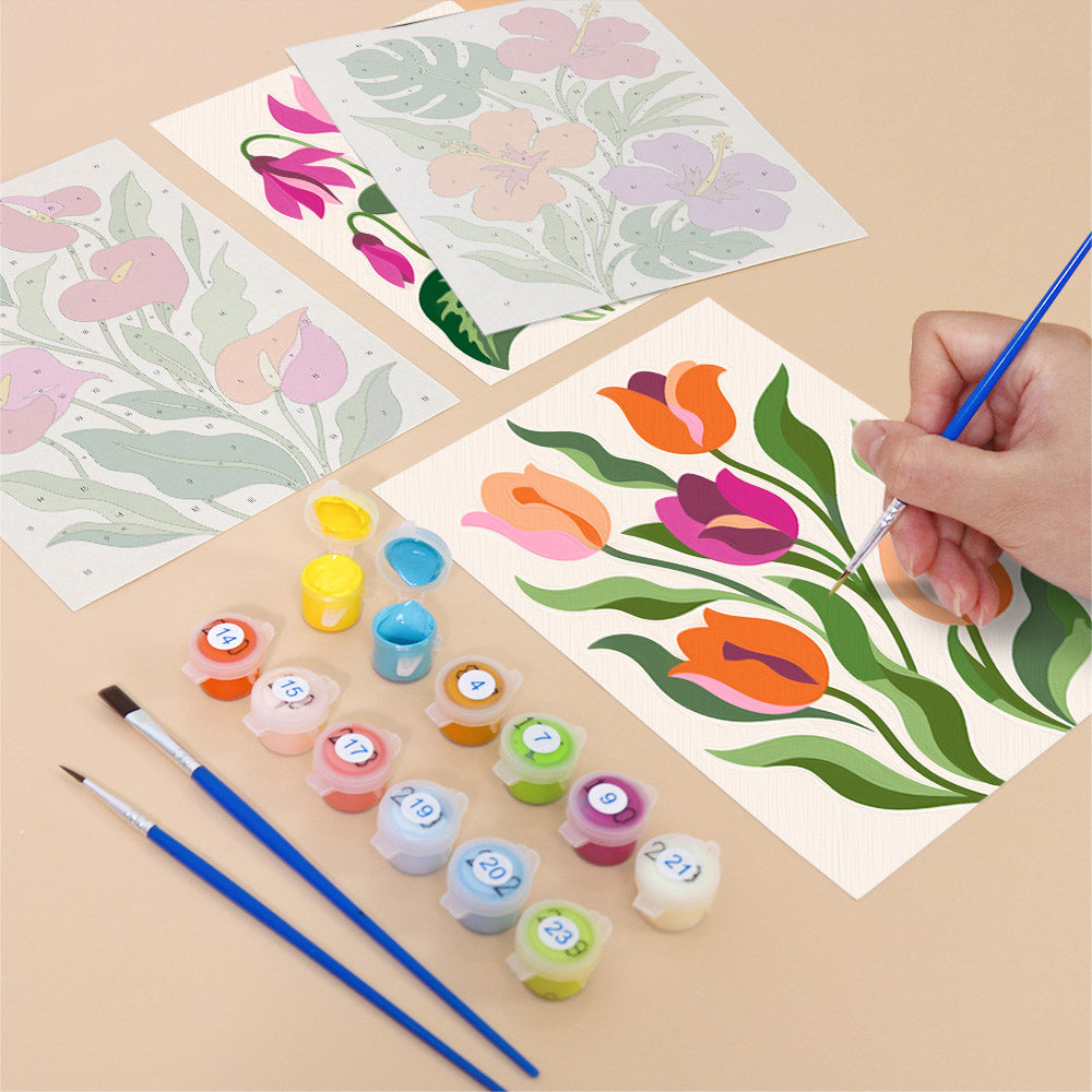 Filling in a Bold Botanicals mini canvas with numbered acrylic paints and a fine brush