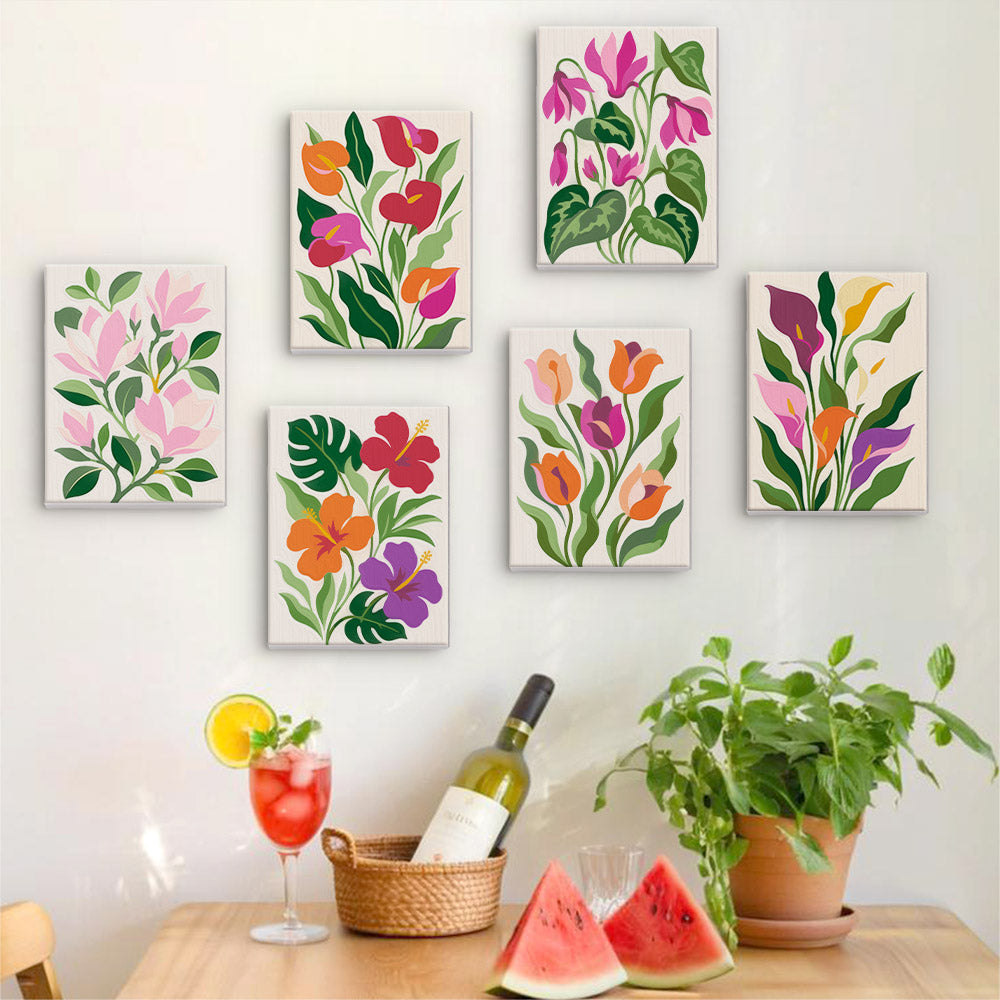Six finished Bold Botanicals mini paintings hung on a wall above a table