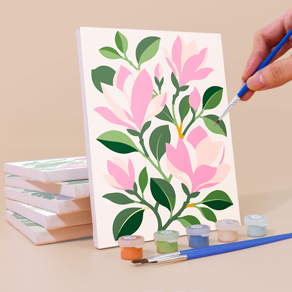 Painting a Bold Botanicals mini canvas propped up beside numbered acrylic paints