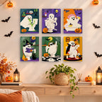 Boo Bathroom Buddies mini paintings displayed as a gallery wall in a sunny kitchen