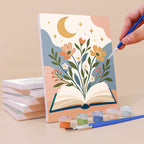 Painting a Book Lover's Corner mini canvas propped up beside numbered acrylic paints