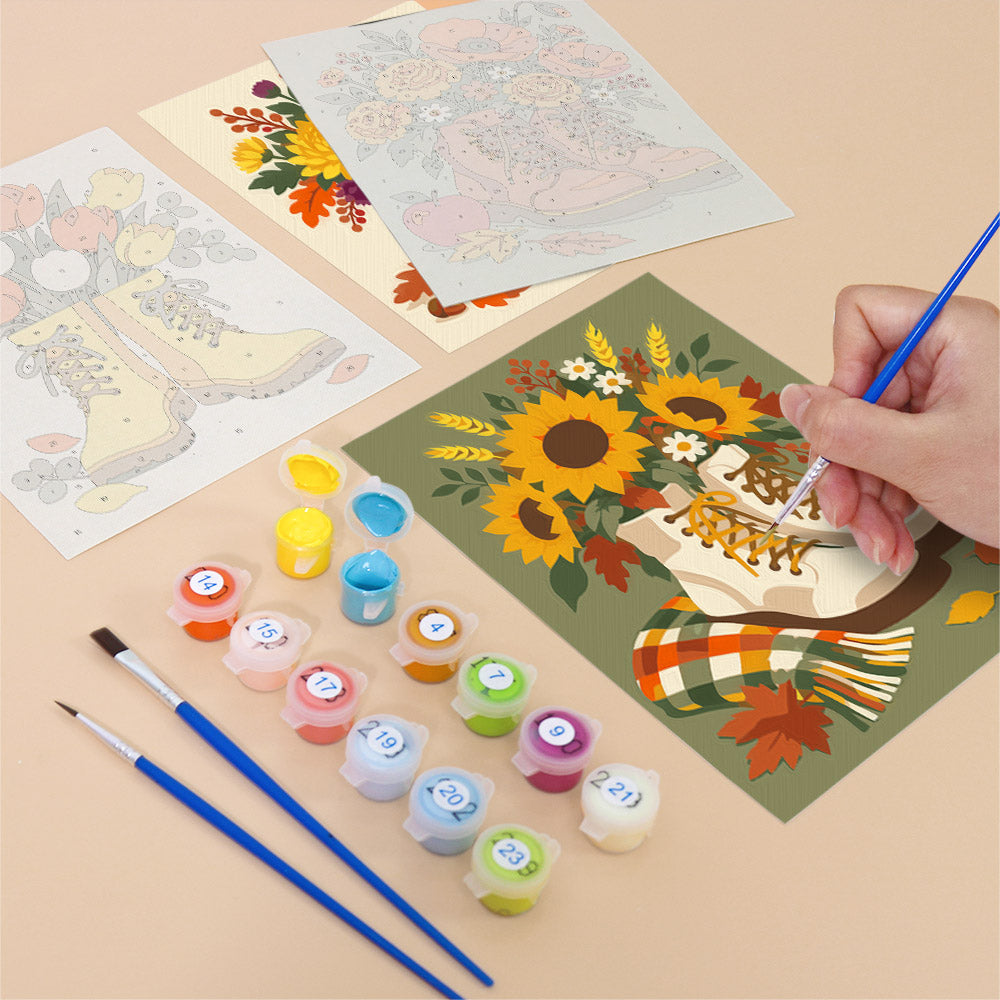 Filling in a Boot Bouquets mini canvas with numbered acrylic paints and a fine brush