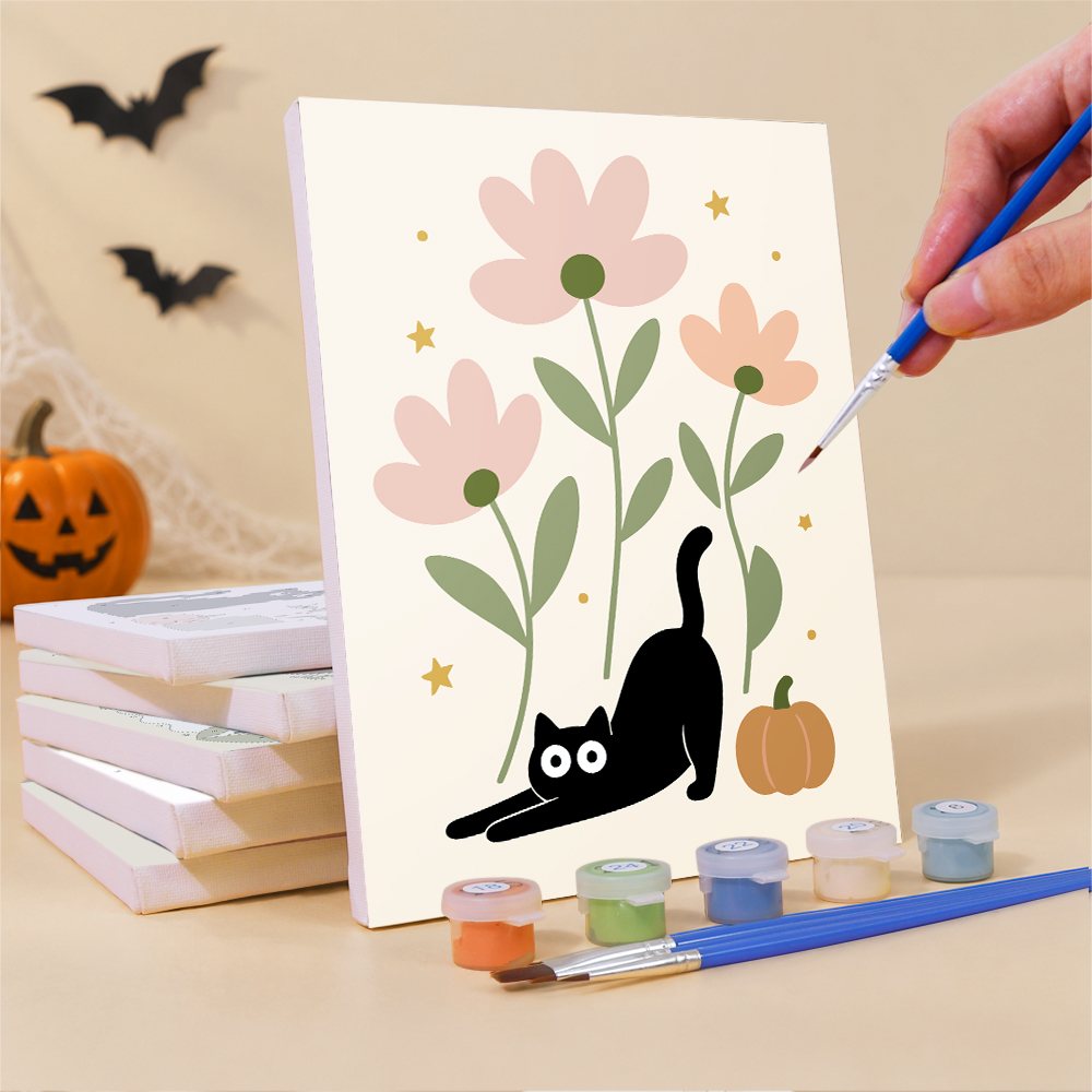 Painting a Botanical Black Cats mini canvas propped up beside numbered acrylic paints