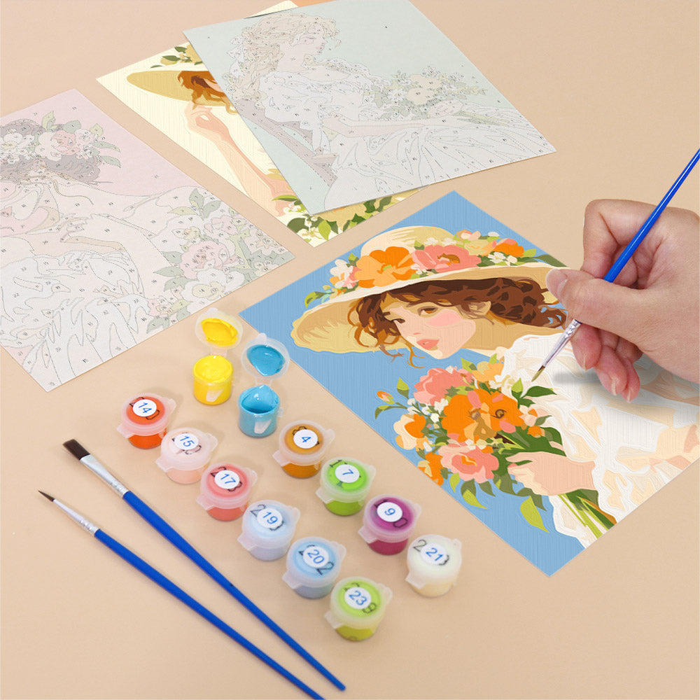Filling in a Bouquet Belles mini canvas with numbered acrylic paints and a fine brush