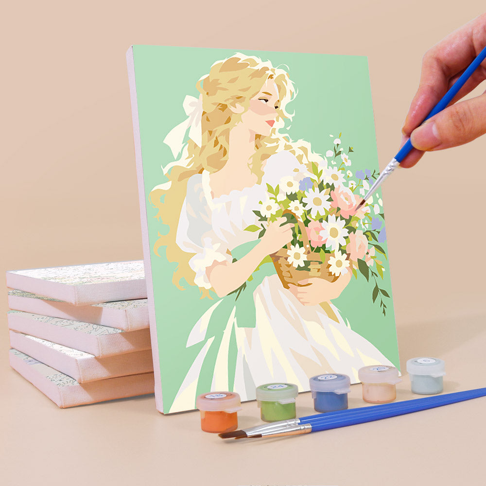 Painting a Bouquet Belles mini canvas propped up beside numbered acrylic paints