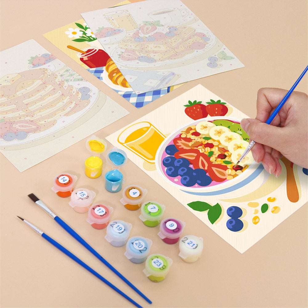 Filling in a Breakfast Spread mini canvas with numbered acrylic paints and a fine brush