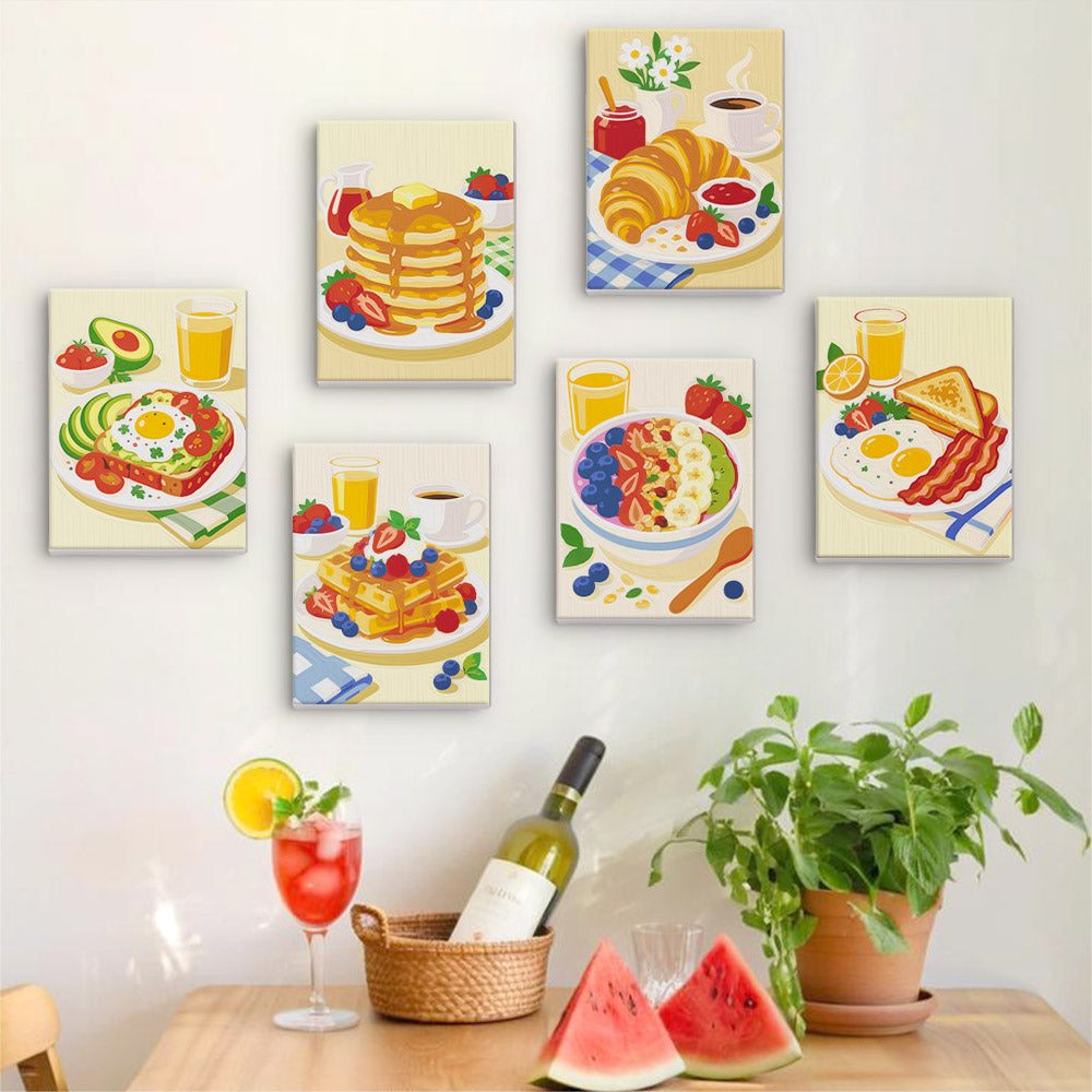 Six finished Breakfast Spread mini paintings hung on a wall above a table