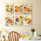 Breakfast Spread mini paintings displayed as a gallery wall in a sunny kitchen